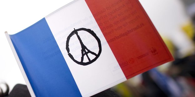 Frankreichflagge mit Eiffelturm als Friedenszeichen