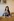 Shirin an einem Tisch sitzend