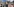 Menschen mit Plakaten und jesidischen Fahnen vor dem Brandenburger Tor