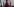 Ein Mann ist auf einem Bildschirm zu sehen, er hält sich ein Fernglas vor die Augen, in dessen Linsen das Facebook-Logo prangt