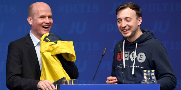 Beim Deutschlandtag der "Jungen Union" lachen Ralph Brinkhaus und Paul Ziemiak