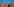 Das Bild zeigt einen Turm des Berliner Rathauses, auf dem die Flagge des Landes Berlin weht.