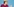 Merkel guckt zur Seite und gestikuliert mit der linken Hand