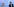 Angela Merkel und Andreas Scheuer stehen nebeneinander vor einer blauen Wand