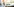 Ein kleiner Junge hat ein Buch auf den Knien, er sitzt alleine auf einer langen leeren Bank und lacht lauthals