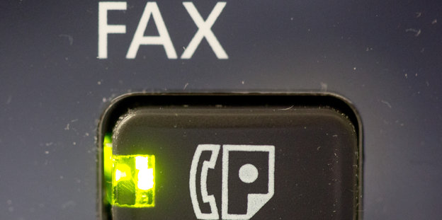 Knopf an einem Faxgerät