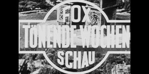 Schriftzug schwarzweiß: "FOX Tönende Wochenschau"