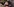 Gesicht von Elke Brauweiler, die Augen sind verdeckt und sie trägt einen Hut