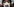 Ein Gesicht in Nahaufnahme mit weißer Atemschutzmaske, darauf ist die Zahl 2038 geschrieben