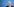 Olaf Scholz vor einem blauen HIntergrund