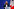 Die französische Rechtspopulistin Marine Le Pen steht vor einer Frankreich-Flagge an einem Pult und redet