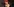 Annegret Kramp-Karrenbauer mit roter Baskenmütze und geschlossenen Augen