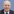 Mann mit Glatze und Anzug