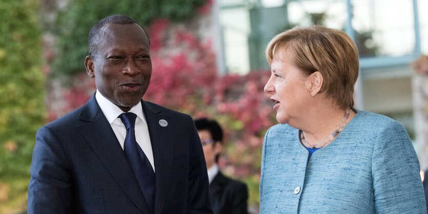 Patrice Talon und Angela Merkel