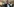 Bild von Adil Demirci in einem Flur, im Hintergrund Leute