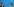 Katja Kipping und Annalena Baerbock strahlen einander an, sie sitzen vor einer blauen Wand