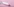 Ein Tampon liegt auf einem rosa Untergrund