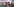 Menschen posieren vor einem Banner mit der Aufschrift "World of Whorecraft"
