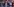 Polizisten stehen vor Menschen mit Bannern und Antifa-Flaggen