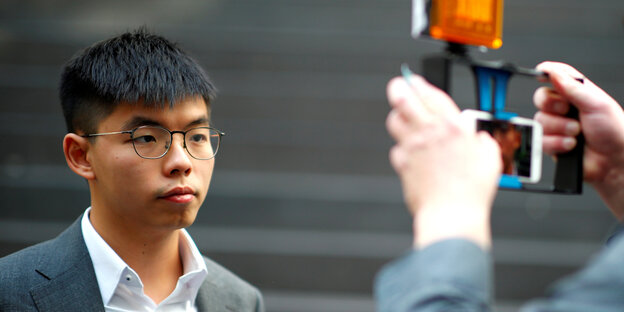 Hongkongs Demokratie-Aktivist Joshua Wong wird fotografiert