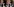 Männer in traditionaller Kluft, seitlich vom Bauch abwärts fotografiert