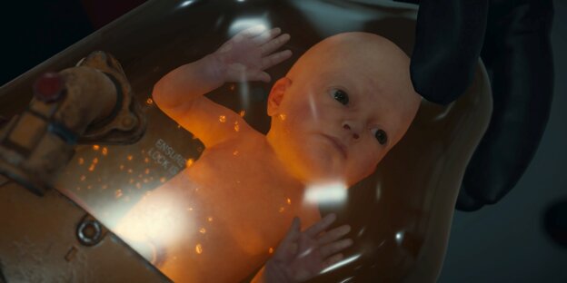 Ein Baby in einer Art Inkubator