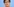 Portrait von Annegret Kramp-Karrenbauer vor blauem Hintergrund