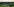 Eine grüne Landschaft mit vielen Windrädern