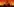 Schwarze Gestalten mit grünen Augen sitzen vor einem feuerroten Hintergrund um ein Lagerfeuer.