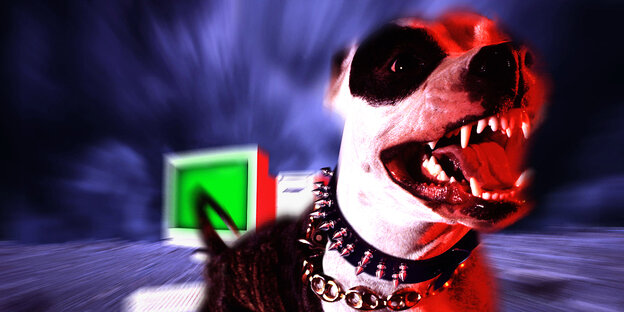 Zähnefletschender Hund vor einem Rechner