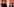 Die Fraktionsvorsitzenden der Partei DIE LINKE im Bundestag, Amira Mohamed Ali und Dietmar Bartsch stehen vor einem roten Banner der Linken.