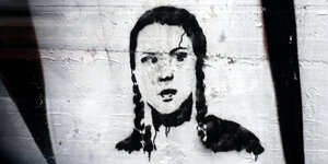 Graffiti mit dem Kopf von Greta Thunberg.