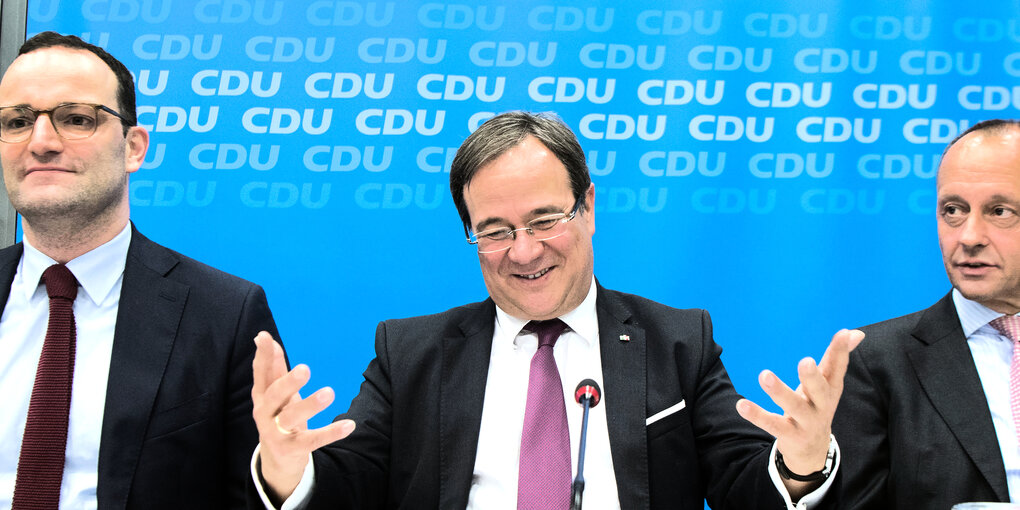 Jens Spahn, Armin Laschet und Friedrich Merz bei einer Pressekonferenz.