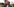Kizito Mihigo steht neben einem Polizisten vor der Presse.