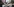 Eine Frau mit Kopftuch und erhobenen Armen protestiert vor einem Plakat mit dem Bild des indischen Ministerpräsidenten Modi gegen die Gewalt in Neu-Delhi