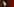 Katharina Zacharias am Rednerpult. Sie ist eine junge Frau mit blasser Haut und einer schmalen Nase. Ihre Haare sind dunkel, sehr voll, gewellt und lang.