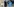 Mann mit Maske misst mit Fiebertheromoter anderen Mann