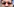 Ein Mann mit einer roten Sonnenbrille in Herzform, auf jedem Glas ein Atomkraft Nein Danke Aufkleber a in Herzform auf