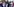 Demonstarnten mit Portraitfotos und Banner.