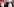 Präsident Duda mit anderen Personen winkend auf einer Bühne.