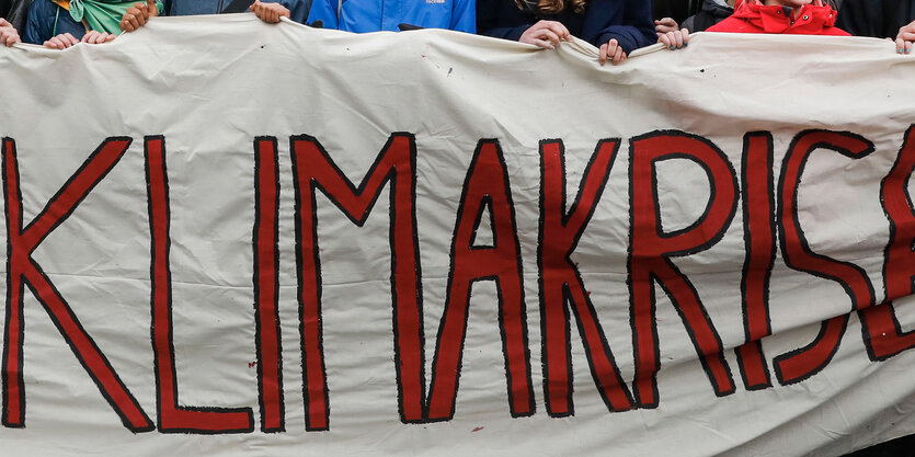 Kimakrise auf Protestbanner