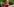 Frau mit hennaroten Haaren und Sonnebrille isst Quark