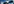 Ein Kreuz vor blauem Himmel im Gegenlicht - die Sonne scheint mittig hindurch
