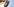 Ein Abzeichen der nordrhein-westfälischen Polizei, fotografiert auf einem Hemd in der Landesleitstelle der Polizei