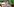 Anastasia Umrik ist eine Frau mit kurzem dunklem Haar und knallrot geschminkten Lippen