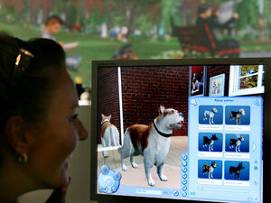 Eine Person sitzt vor einem Computerbildschirm und wählt im Spiel die Hunderasse aus
