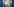 Ein Intensivpfleger ist hinter einer Schleuse bei seiner Arbeit in einer Schutzausrüstung mit Mund-Nasenbedeckung, Gesichtsschutz, Kittel und Haube auf der Intensivstation des Krankenhauses Bethel Berlin an einem Corona-Patienten zu sehen.