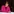 Bremens Gesundheitssenatorin Claudia Bernhard spricht bei einer Pressekonferenz. Sie trägt schwarze kinnlange Haare, eine dunkle Hornbrille und eine pinke Strickjacke