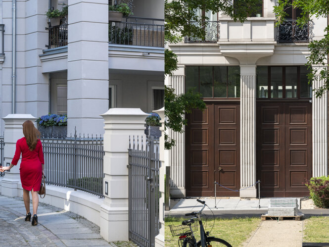 Townhouses in Berlin, eine Frau im roten Kleid geht auf der Straße