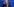 Joe Biden steht vor blauem Hintergrund und kratzt sich nachdenklich am Kopf